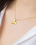 Pendente coração liso em prata banhado a ouro