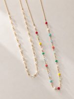 Colar Comprido em Aço Dourado com Contas Coloridas – foto 2